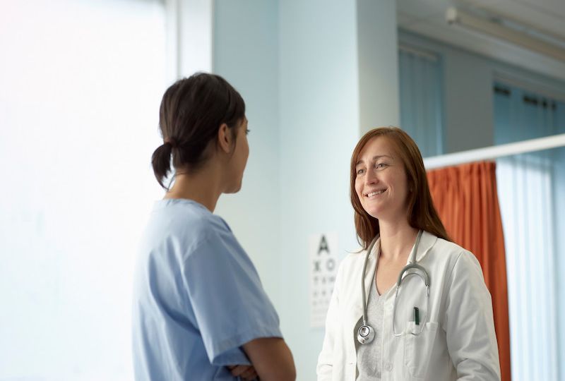 Nurse and doctor in discussion