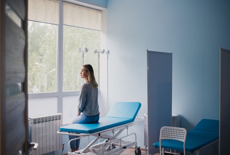 Woman waiting for doctor in hospital